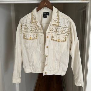 Jean jacket with gold bead detail.